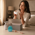 Woman opening a box containing skincare devices in a cozy room.
