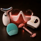 Collection of skincare devices on a dark background
