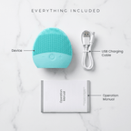 Turquoise facial cleansing device with USB charging cable and operation manual on a marble surface
