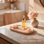 Skincare products on a marble tray with a vase of roses in a bathroom setting.