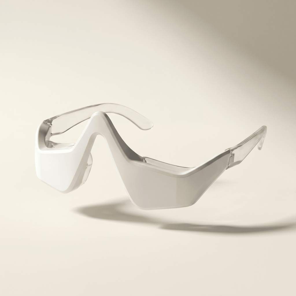 Wearable red light therapy glasses on a beige background