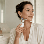 Woman using a skincare device in a bathroom setting